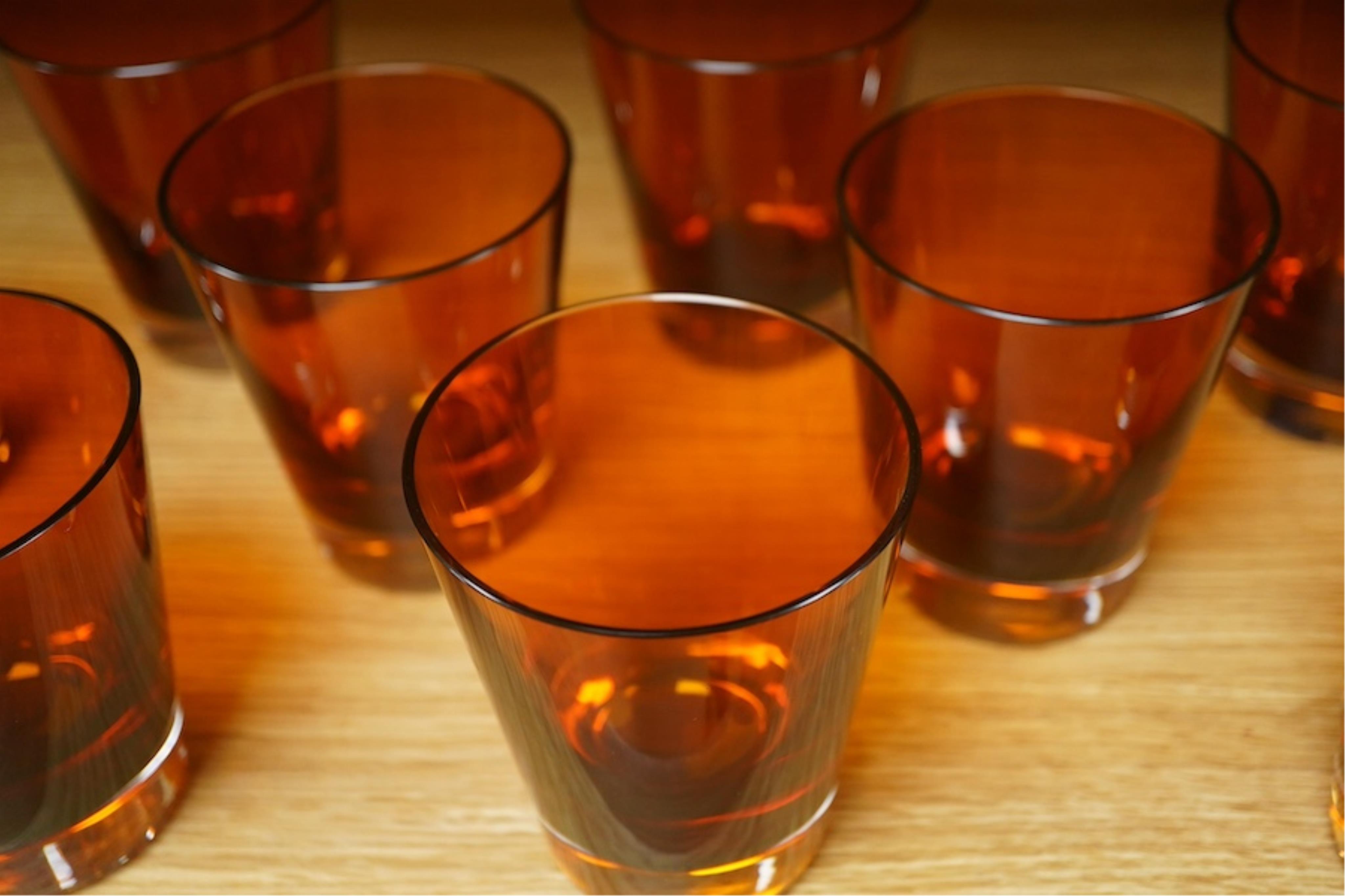 A set of twelve Baccarat Mosaique amber glass tumblers, 10cm. Condition - good